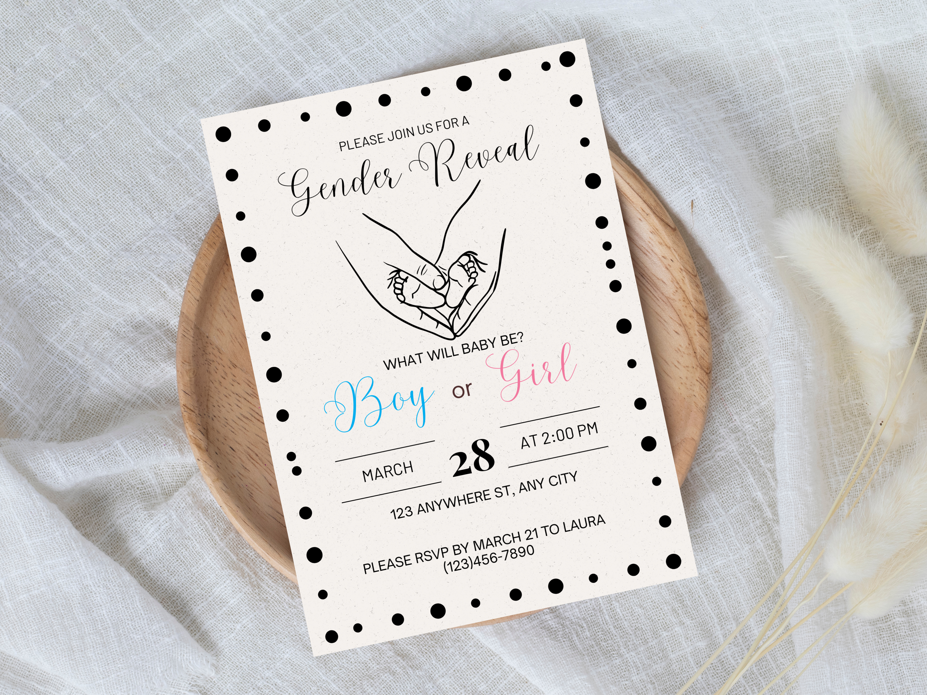 Gender reveal invitation card on a textured surface