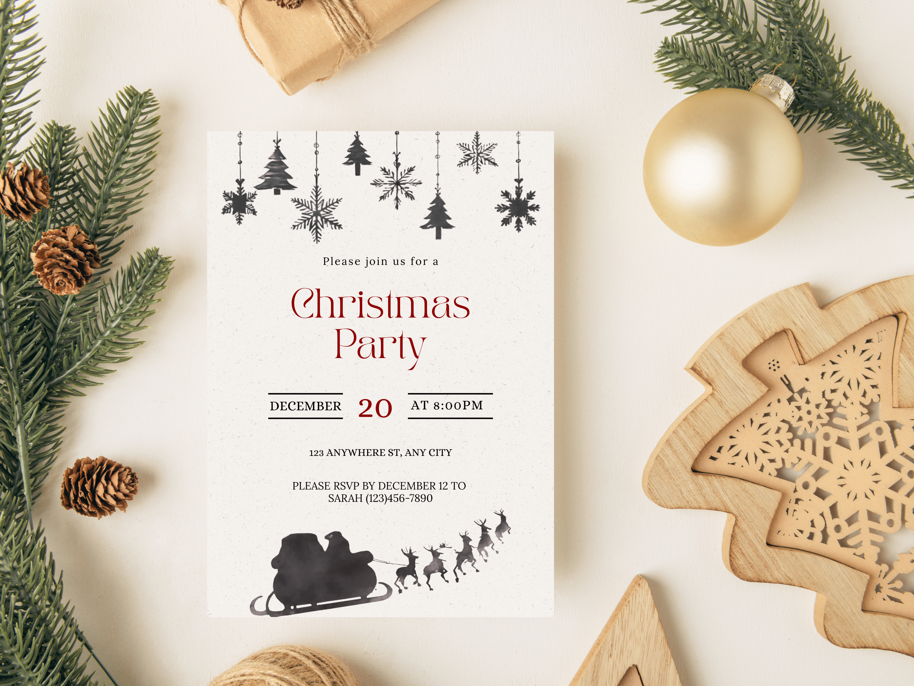 Christmas party invitation with festive decorations on a white surface