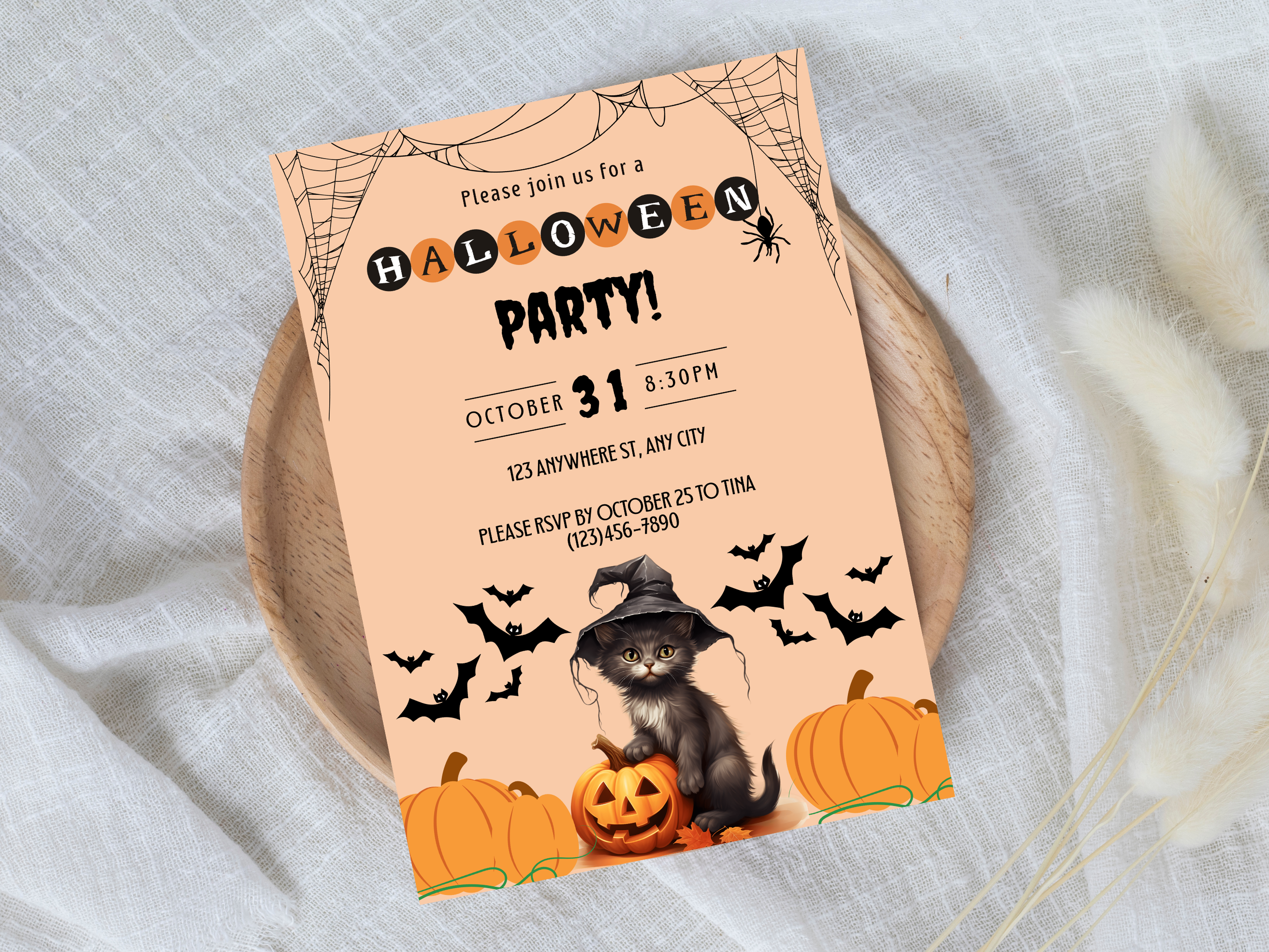 Halloween party invitation with a cat in a witch hat, pumpkins, and bats on a beige background.
