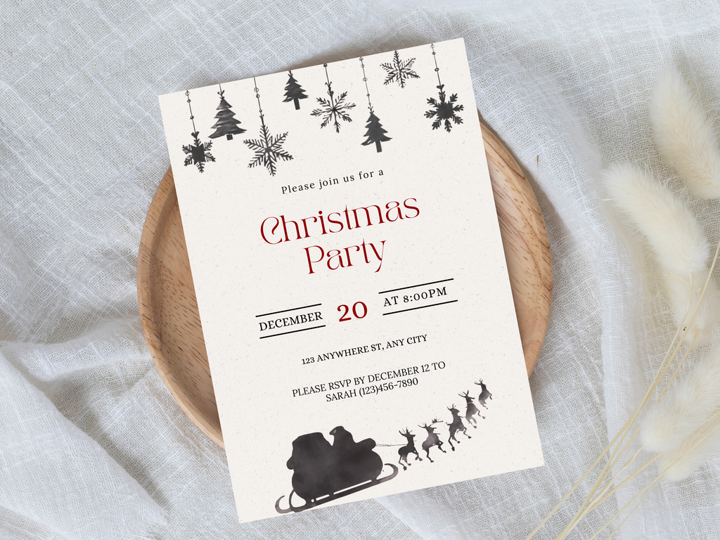 Christmas party invitation card with festive design on a light fabric background