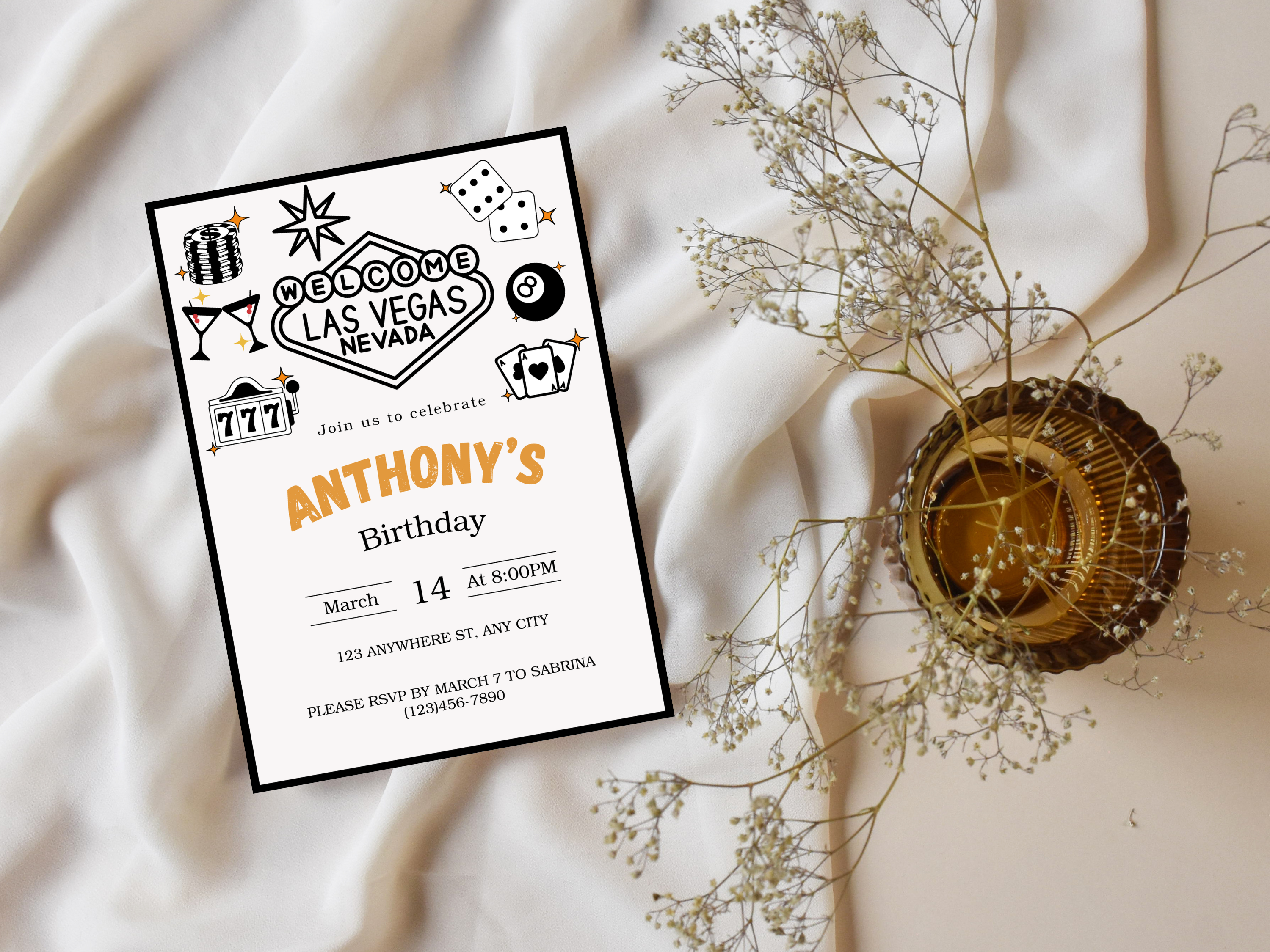 Birthday invitation card with Las Vegas theme on a soft fabric background
