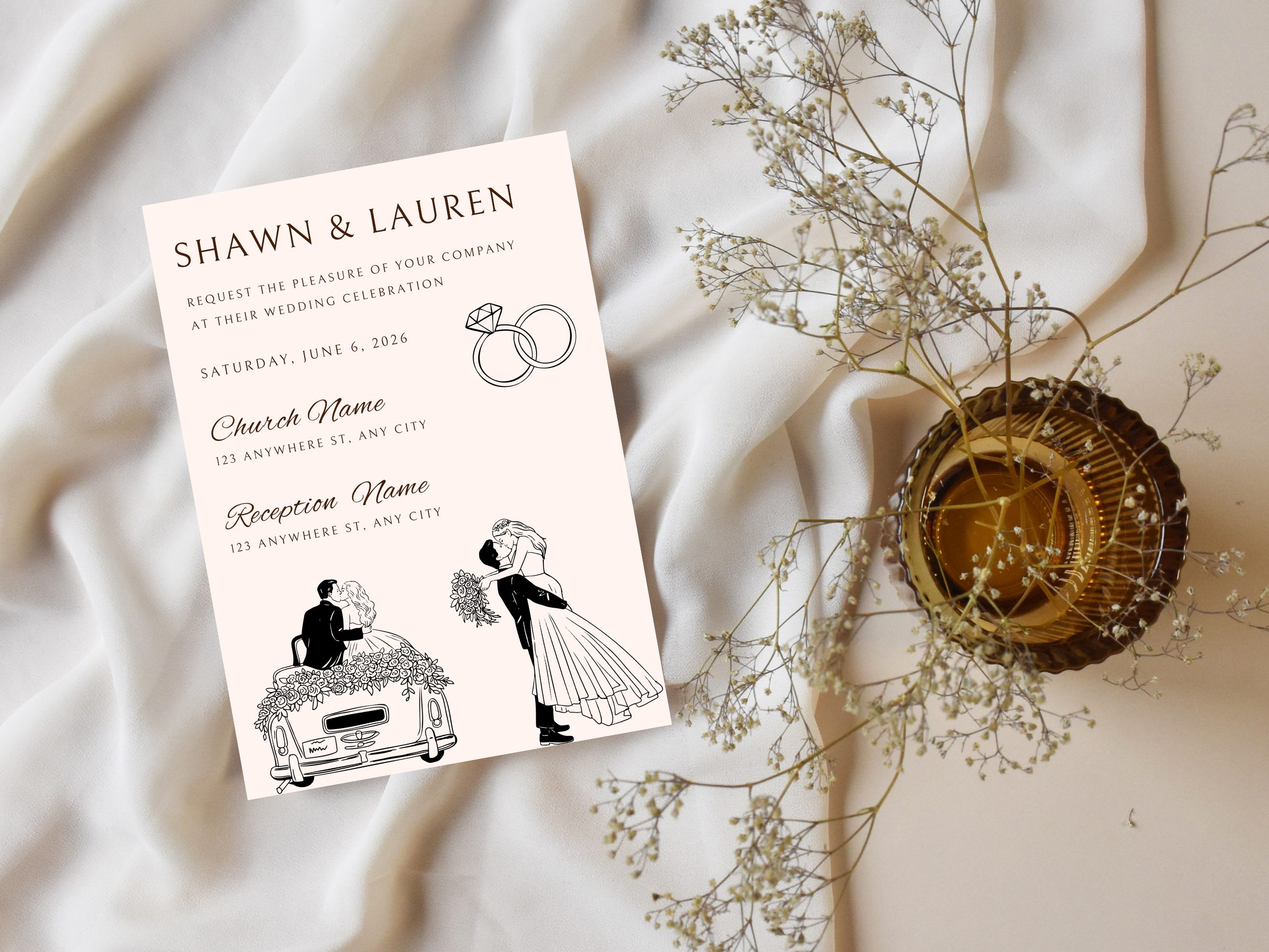 Wedding invitation card with ring and couple illustrations on a soft fabric background