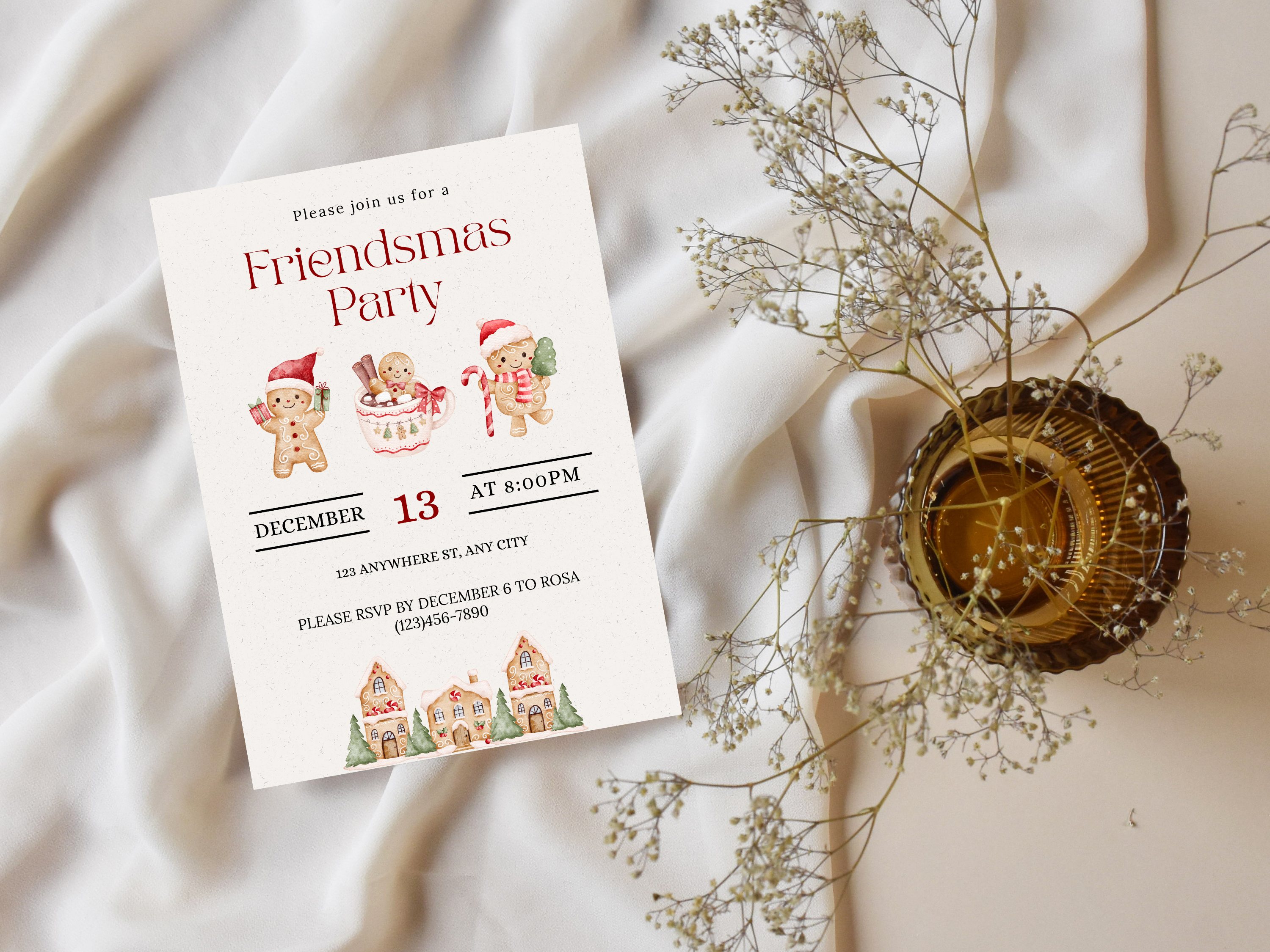 Friendsmas party invitation with festive design on a white fabric background