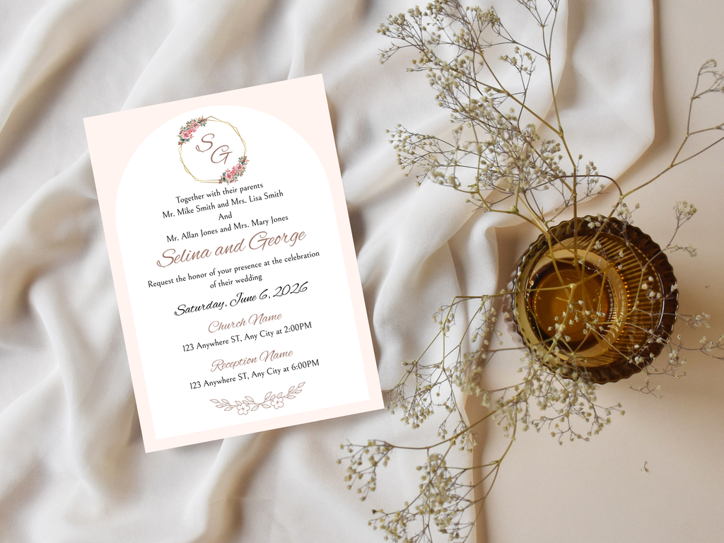 Wedding invitation card with floral design on a soft fabric background