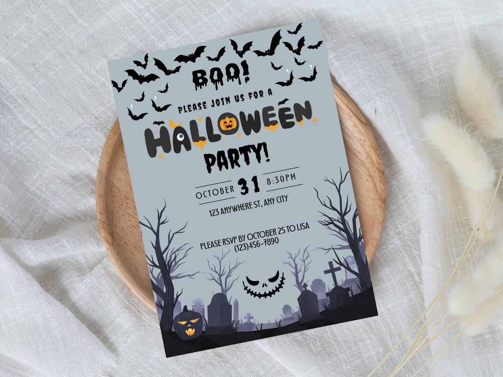 Halloween party invitation card with pumpkins, bats, and a graveyard design on a white fabric background.