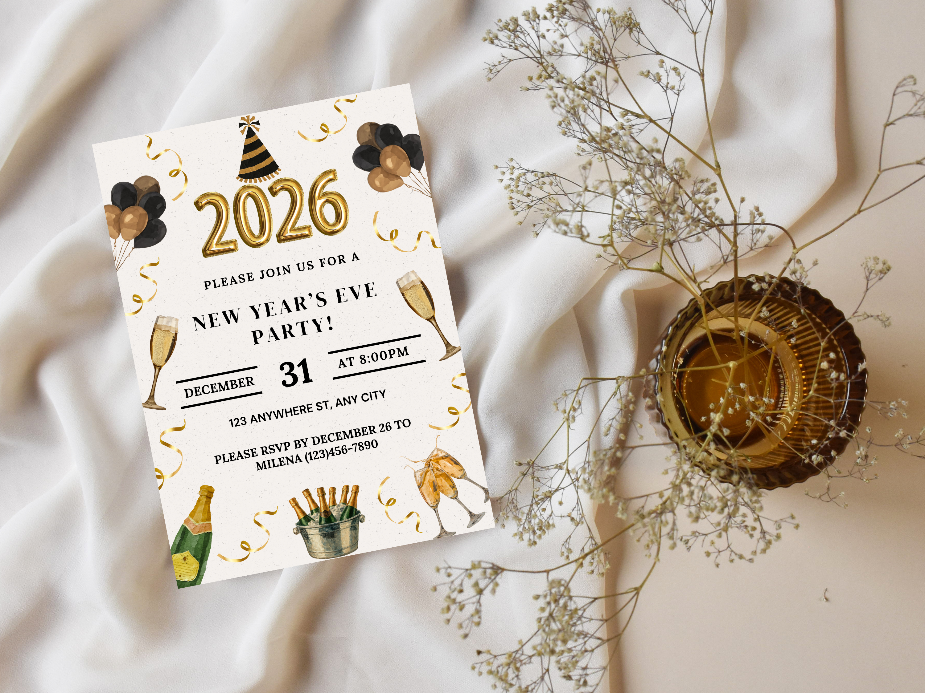 New Year's Eve party invitation card with festive design on a soft fabric background.