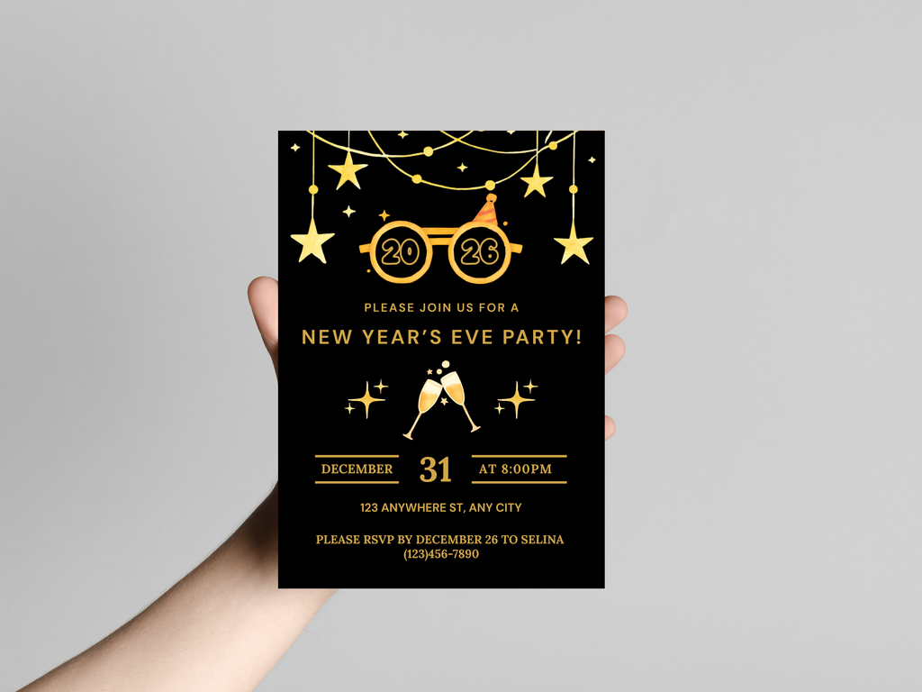 Hand holding a New Year's Eve party invitation card with gold text on a black background.