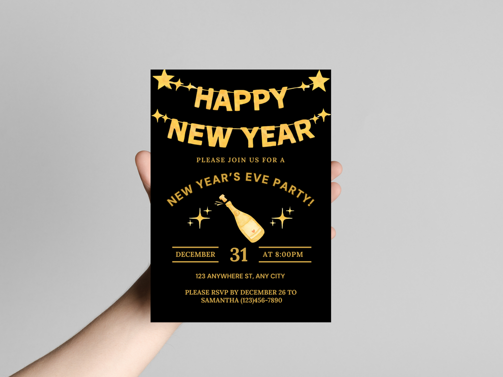 Hand holding a New Year's Eve party invitation card with gold text on a black background.